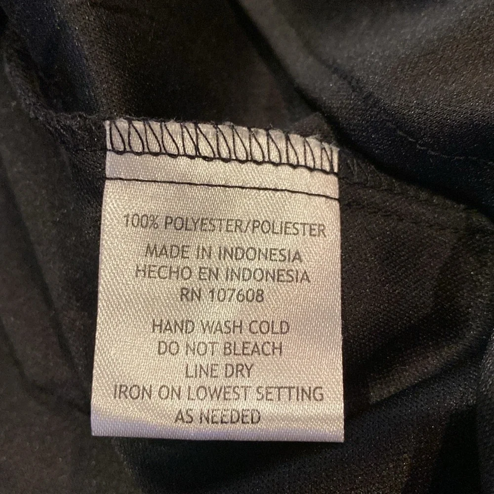 Karin Steven’s sleeveless black/white patterned lined dress. Tie at neck & waist